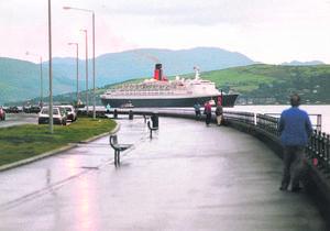GRACE AFLOAT: The great ship makes her way up river past Greenock Esplanade in 1994.