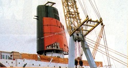 QE2's new, fatter funnel is fitted during the final stages of her conversion