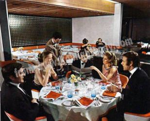the largest restaurant on the ship, the gay Britannia Restaurant was designed by Dennis Lennon and seats 815. 
