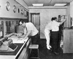 Picture alongside shows the chart room, navigational centre of the ship.