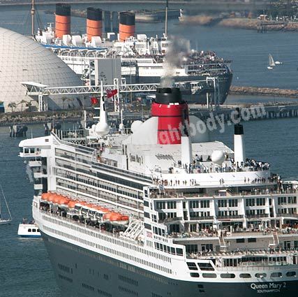 Queen Mary welcomes her young sister Queen Mary 2 (QM2) to Long Beach Harbor using her fog horns.  QM2 replies with her identical horns. 23rd February 2006. Photo from the picture story on LA Times.com